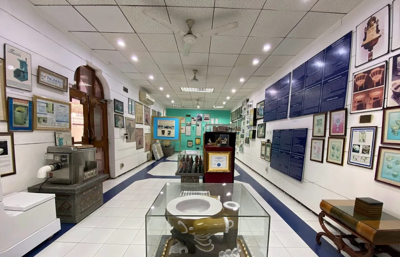 A unique exhibit inside the Sulabh International Museum of Toilets, showcasing the history and evolution of sanitation systems from ancient times to modern innovations.